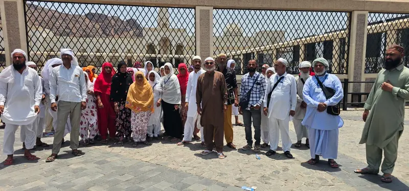 The full Madni Tour & Travels pilgrim group photographed together on a Ziyarat visit